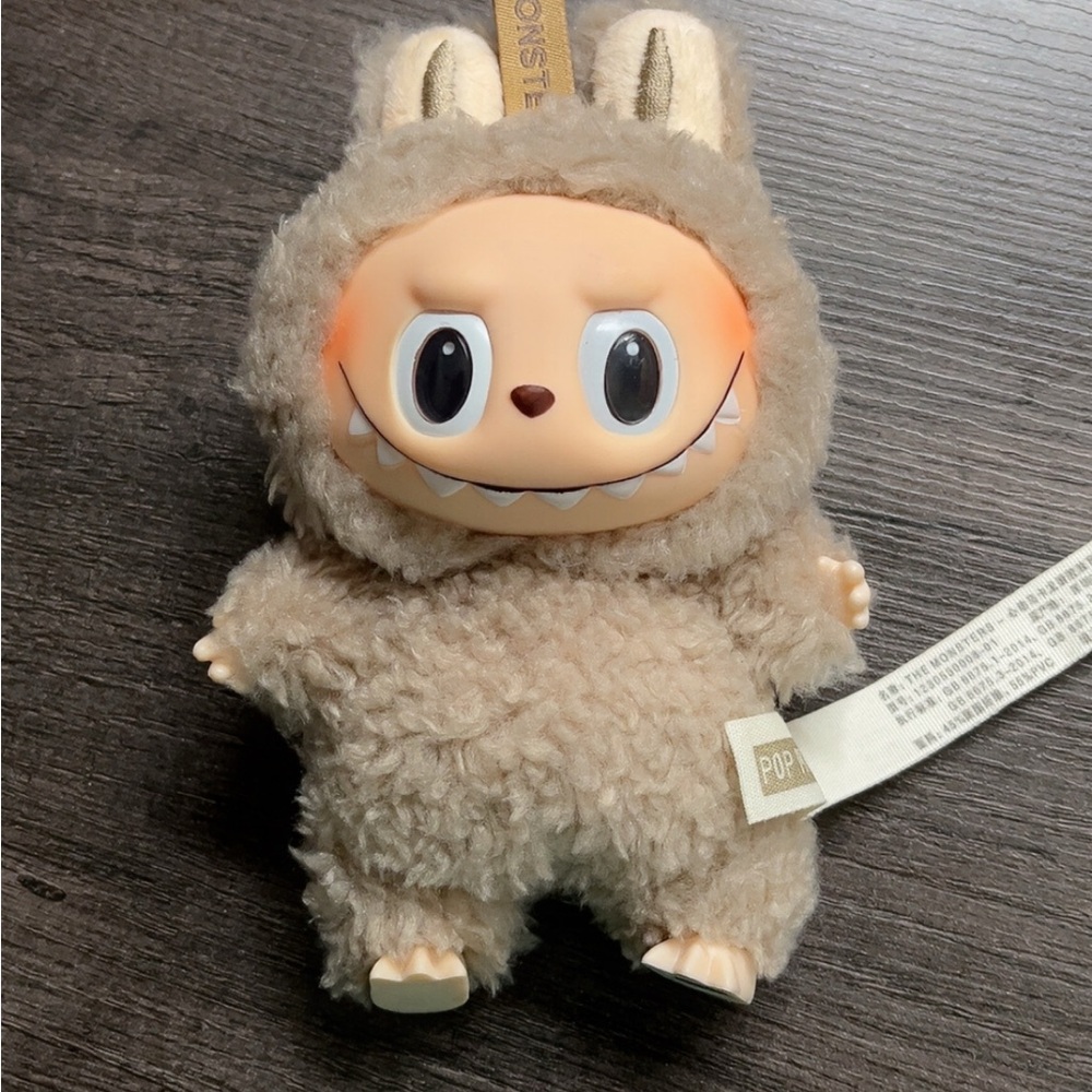 Adorable Tan Plush toy.
